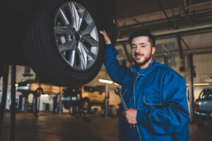 auto-mechanic-with-wrench-stands-near-a-car-on-a-l-2024-10-20-09-25-14-utc3.jpg