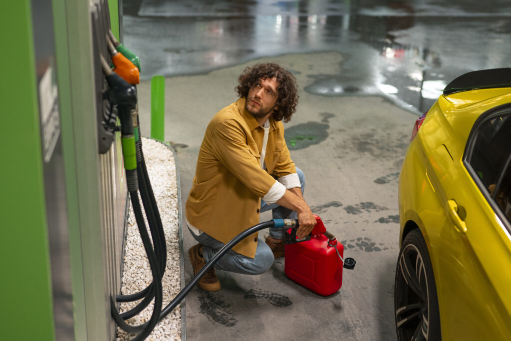 full-shot-man-gas-station